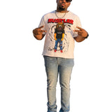 Man wearing a graphic t-shirt with rhinestones and a cityscape in the background 
