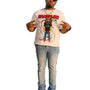 Man wearing a graphic t-shirt with rhinestones and a cityscape in the background 